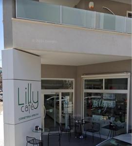 a building with chairs and tables outside of it at Regina Suite in Brindisi