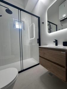 a bathroom with a shower and a toilet and a sink at Apartments Time Off in Zaboric +35 photos