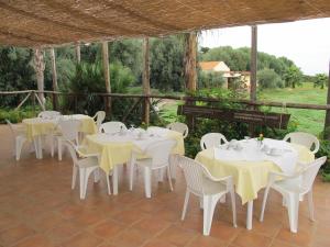 a group of tables and chairs on a patio at Stella Di Sicilia in San Fratello