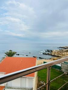 a view of the ocean from a balcony at Appart hôtel palais de mer in Jijel