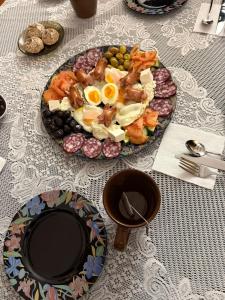 a plate of food on top of a table at Hotel palas tatariv in Tatariv +11 photos