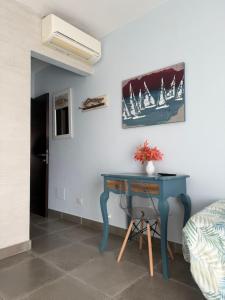 a blue desk in a room with a bed at Bassa Prua in Palau +28 photos