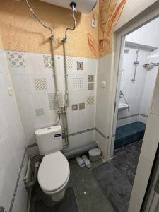 a bathroom with a toilet and a shower at Nõma studio in Varna City +31 photos