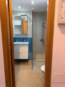 a bathroom with a shower and a sink and a toilet at Delfines 61 in Corralejo