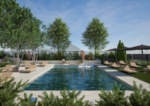 a swimming pool with lounge chairs and a swimming pool at Memento Agriturismo in Cervia