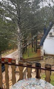 a view of a tree from a balcony at Vikendica Rujiste in Mostar
