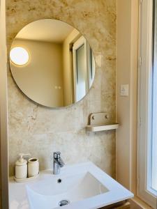 a bathroom with a sink and a mirror at Les Bons Vivants - L'appartement in Trouville-sur-Mer +22 photos