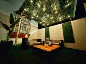 a room with a table with lights on the ceiling at Ronko House El Ronquillo in El Ronquillo +36 photos