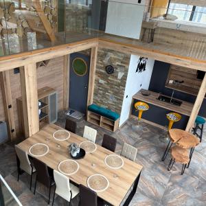 an overhead view of a table and chairs in a room at Loft Chalet Bansko in Bansko +31 photos