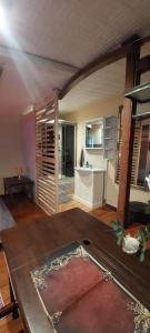 a living room with a table and a sink at Ofiss 24 in Riga