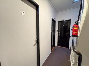 a hallway with a fire hydrant next to a door at Hotel Bellington in Amsterdam