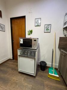 a microwave sitting on top of a counter in a kitchen at Sarr in Santa Fe