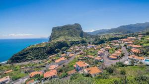 an aerial view of a small town on a mountain at Vivenda Fortim in Faial