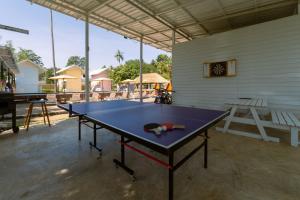 a ping pong table in the middle of a room at Slumber Resort Koh Chang in Ko Chang