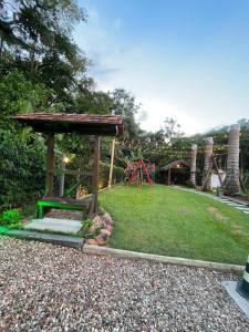 a park with a gazebo and a playground at Familien Haus Pousada in Pomerode