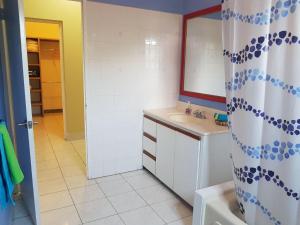 a bathroom with a sink and a mirror at Montego Bay Sea View Guesthouse in Montego Bay +13 photos