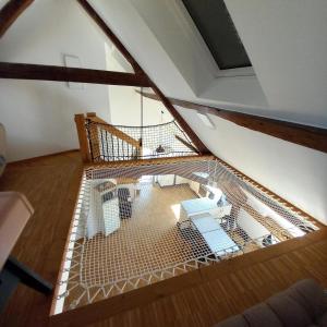 a bird cage in the middle of a room at Cosy Eco-Loft in Pettingen
