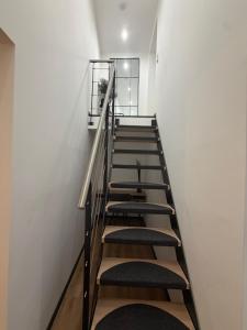 a group of stairs in a white wall at Zauberhafte Erdgeschoss-Maisonettewohnung in Bovenden