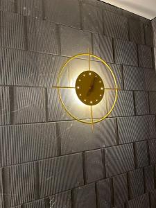 a clock on the side of a brick wall at Panorama Nacional in Ávila +40 photos