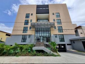 a large building with stairs in front of it at Flat Completo Porto de galinhas in Porto De Galinhas