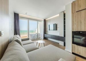 a living room with a couch and a television at The Seaview Jacuzzi Suite by PS in Golem