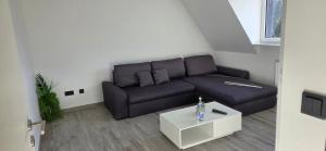 a living room with a couch and a coffee table at casa stadio2 in Leverkusen