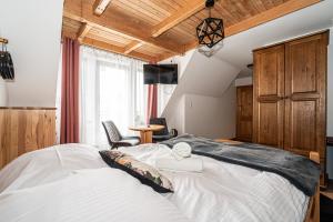 a bedroom with a large bed in a room at Willa u Baranów 2 in Zakopane +95 photos