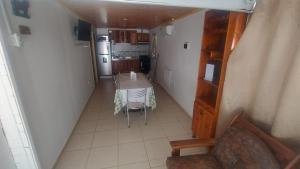 an overhead view of a kitchen and a table in a room at Cabaña Mailin II in Uspallata