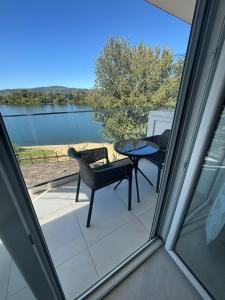 a view of a patio with a table and chairs at Apartman studio BMB 1 in Bukorovac