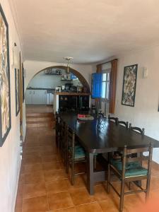 a kitchen and dining room with a table and chairs at Casa Mariscal Polopos in Polopos +93 photos