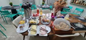 a wooden table with food on top of it at THEHotelBoutiqueCidadeVelha in Belém