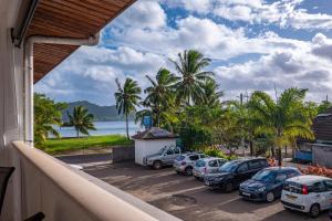 a view from a balcony of a parking lot with cars at Studio Coquet - Mautara Lodge in Bora Bora