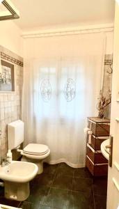 a bathroom with a toilet and a sink at Eucalipto in Sestri Levante +32 photos