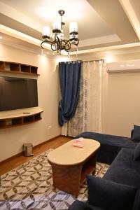 a living room with a couch and a table at Nabo House in Abu Simbel
