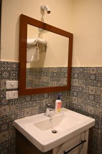 a bathroom with a sink and a mirror at Nabo House in Abu Simbel +32 photos