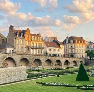 a view of a city with a bridge and buildings at Le cocon des familles - 2 Chambres in Vannes