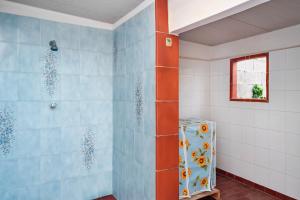 a bathroom with a shower with blue tiles at Villetta Patitari in Gallipoli +44 photos