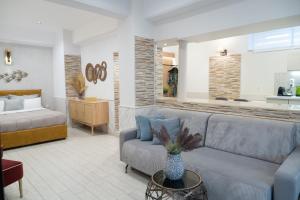 a living room with a couch and a bed at Mediterranean in Preveza