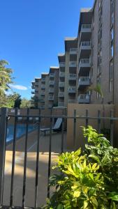a view of a building from behind a fence at Nani Kai Hale # 204 Hotel District! in Kihei