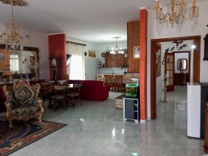 a room with a living room and a dining room at Casa di Roberto in Porto Cesareo