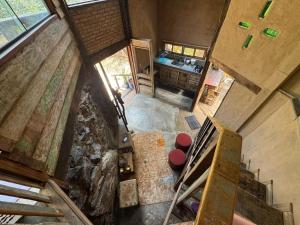 an overhead view of a kitchen and stairs in a cabin at Chalé João de barro in Bonito