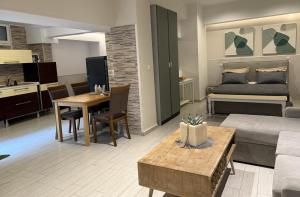 a living room with a couch and a table at Mediterranean in Preveza