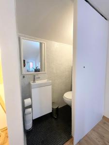 a bathroom with a sink and a toilet at St Peter's Heritage House in Trogir +44 photos