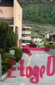 a parking lot with a sign that says love at Studio My Home in Brig