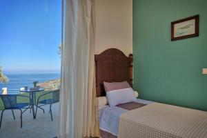 Кровать или кровати в номере Olivia's Villas of Luxury