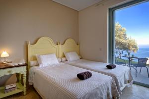 Кровать или кровати в номере Olivia's Villas of Luxury