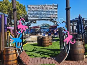 a playground with a slide in a park at Liberty hill Executive Inn in Zephyrhills