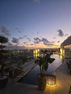 a view of a building with a pool of water at Whispering Waves at Mercury Tower with panoramic view , 2X pools and Gym in Paceville