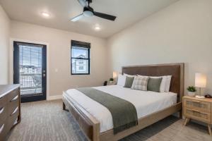 a bedroom with a large bed and a window at Flying Moose at Helling Circle 101 condo in Heber City