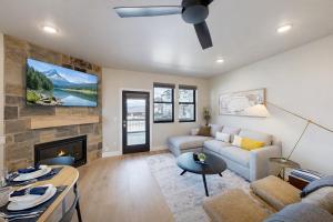 a living room with a couch and a fireplace at Flying Moose at Helling Circle 101 condo in Heber City +55 photos